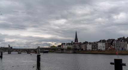 Clouds above the Maas river in Maastricht, with the Wilhelminabrug bridge in the distance. May 10, 2021