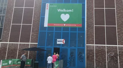 People line up for a Covid-19 vaccination at the GGD location at NDSM in Amsterdam. 12 July 2021