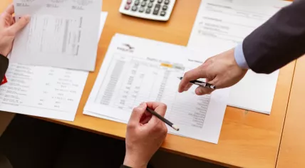 People analyzing data tables