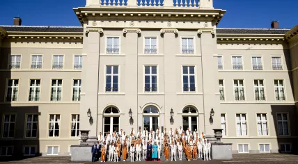 King Willem-Alexander and Queen Maxima pose on the steps of Noordeinde Palace for a group photo with the medal winners of the 2020 Olympic Games in Tokyo, 10 August 2021