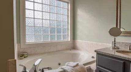 White ceramic bathtub in a bathroom