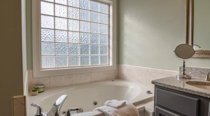 White ceramic bathtub in a bathroom