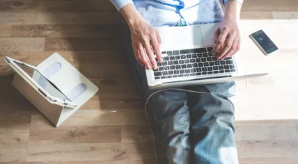 Man with laptop, tablet and smartphone