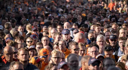 A large crowd makes its way from the Zandvoort train station to the racetrack in advance of the start of the first Formula 1 race weekend in the Netherlands since 1985. Sept. 3, 2021