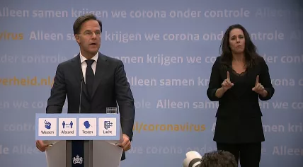 Mark Rutte and interpreter Irma Sluis during a press conference on 14 September 2021