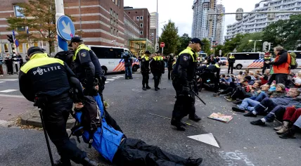 Extinction Rebellion protestors dragged away from an intersection separating the current Tweede Kamer and Ministry of Economic Affairs buildings. 11 Oct. 2021