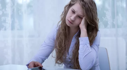Stock photo of woman upset about online comments