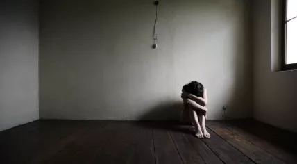 Stock image of girl in dark room