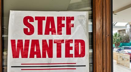 Staff wanted sign in a window