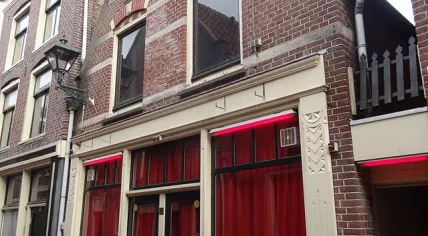 Red curtains drawn shut on the Achterdam, Alkmaar's sex worker street
