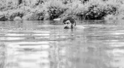 Man swimming in a lake