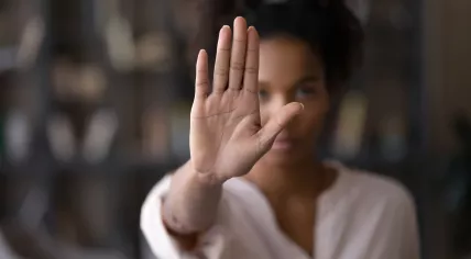 Woman signaling stop with hand 