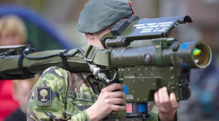 A soldier demonstrates the FIM-92 Stinger portable surface-to-air missile system.   