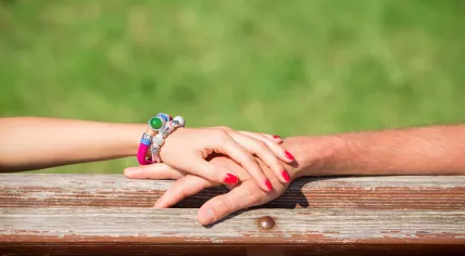 Couple holding hands