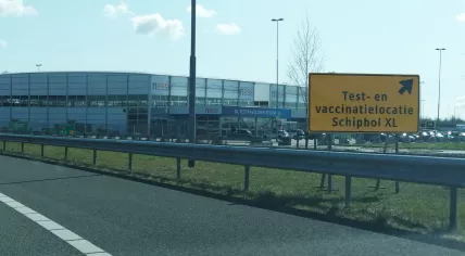 Signs leading to drivers to the GGD Kennemerland coronavirus testing and vaccination center at Schiphol. 17 April 2021