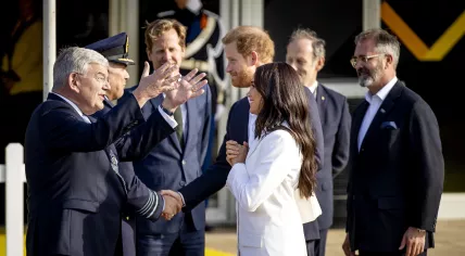 The Duke and Duchess of Sussex, Prince Harry and Meghan Markle, on the Yellow Carpet with Mayor Jan van Zanen ahead of the Invictus Games. 15 April 2022