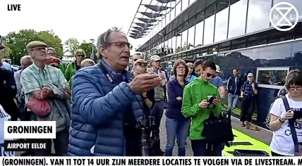 Protesters gather at Groningen Airport Eelde on May 14, 2022.