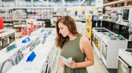 Woman shopping for a washing machine