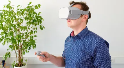 A man using an Oculus virtual reality system in 2018
