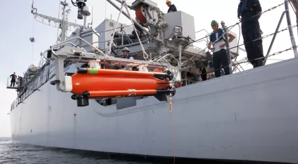 An unmanned SeaFox unit lowered into the water from the Zr.Ms. Vlaardingen minesweeper to investigate a possible mine during a drill in 2012
