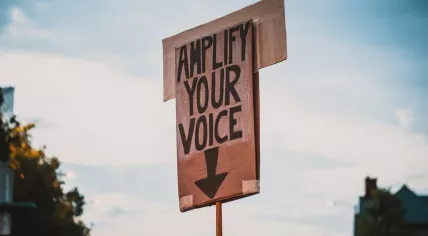 A protest sign inviting people to speak up and be heard. June 2020