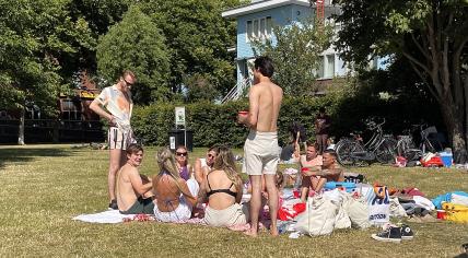 A group of people enjoying the sun on Java-Eiland in Amsterdam. 16 July 2022