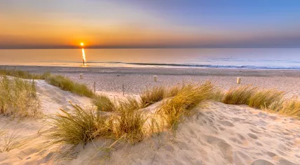 Sunset view over the North Sea in Ouddorp