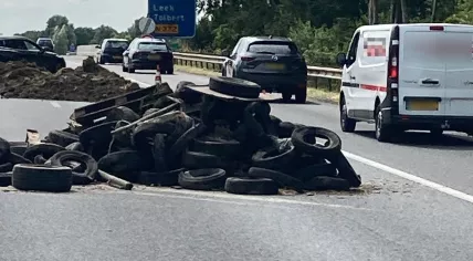 Farmers dumped tires and other waste on the A7 near Leek, 28 July 2022