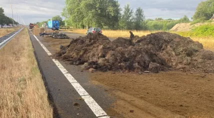 Farmers dump hay bales and soil on Dutch roads to protest against the government's nitrogen policy, 27 July 2022