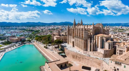 Aerial view of the city center of Palma de Mallorca, Spain, featuring the La Seu gothic cathedral, in June 2022