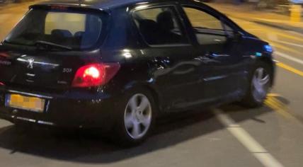 A darker colored Peugeot that sped off from the scene of an assault in Amsterdam on 17 July 2022. The license plate number was clearly visible in the image.