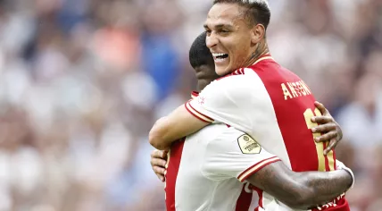 Steven Bergwijn and Antony Matheus Dos Santos celebrate an 3-1 Ajax victor over FC Croningen in the Johan Cruijff Arena, 14 August 2022