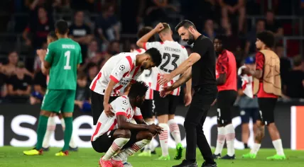 PSV’s Ibrahim Sangare and Ismael Saibari are consoled by coach Ruud van Nistelrooy after the Eindhoven team was knocked out of the Champions League by Rangers FC at Philips Stadium. 24 August 2022