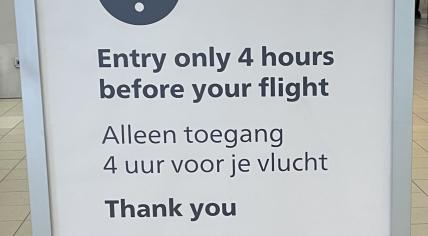 Sign at Schiphol Airport instructing people to wait outside the departure halls until 4 hours before their flight. 23 July 2022