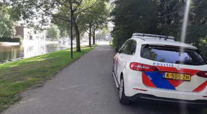 Police at the Erasmuspark in Amsterdam where a magnet fisher found a hand grenade and multiple firearms in the water, 2 August 2022