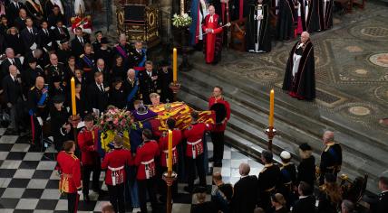 The coffin with the remains of Queen Elizabeth II is placed in Westminster Abbey for her funeral. Princess Beatrix, Queen Maxima, and King Willem-Alexander are seated in the first row next to the Swedish and Danish Royals, 19 September 2022