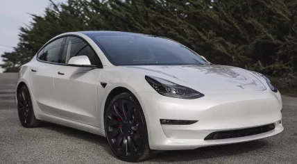  Pearl white electric Tesla Model 3 dual motor performance AWD car with 20 inch Uberturbine wheels near San Francisco.