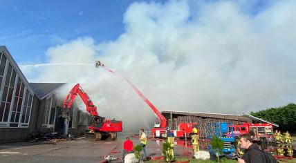 Emergency services fighting a fire at an agricultural business on Herenweg in Heemstede, 12 September 2022