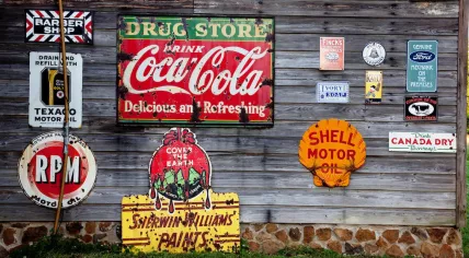 Old advertising signs on the side of a drug store in 2017