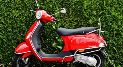 A red Vespa scooter in 2016