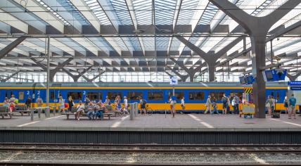 People waiting on a platform at Rotterdam Centraal. 18 June 2017