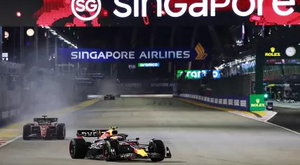 Mexican Formula One driver Sergio Perez of Red Bull Racing and Monaco's Formula One driver Charles Leclerc of Scuderia Ferrari in action during the Singapore Formula One Grand Prix race