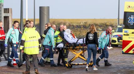 Emergency services helping a wounded passenger in Harlingen after water taxi Stormloper collided with ferry MS Tiger near Terschelling on the Wadden Sea, 21 October 2022