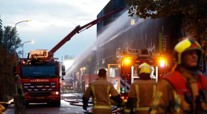 Firefighters at the scene of a fire on Leeuwenstein in Delft, 23 October 2022