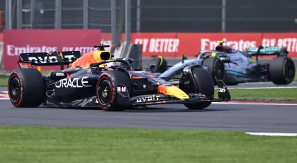 Max Verstappen (L) is chased by Lewis Hamilton as they race during Mexico Grand Prix on October 30, 2022.