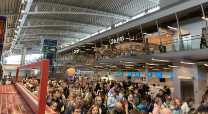 Travelers wait in line at Eindhoven Airport on Oct. 15, 2022.