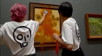 Activists pour tomato soup on Vincent van Gogh's Sunflowers at the National Gallery in London, 14 October 2022