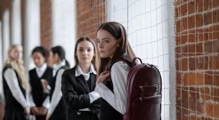 Schoolgirls standing in a hallway