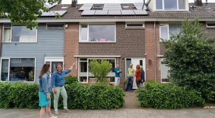 People tour sustainable homes.