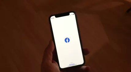 The Facebook app from Meta opening on an iPhone in November 2022